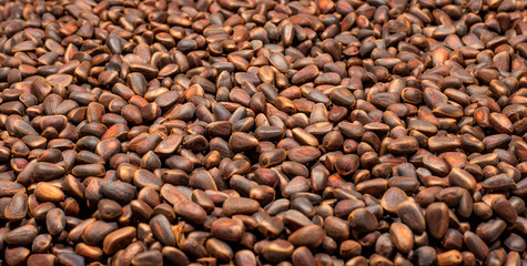 Pine nuts in the form of a background.