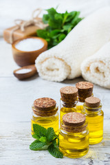 Organic essential oil with green mint leaves, spa concept