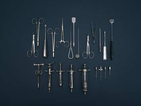 Directly above shot of various medical tools on blue background
