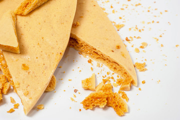 Caramel honeycomb on a white plate 05