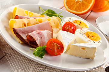 Breakfast with boiled egg, ham and cheese