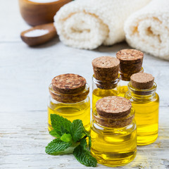 Organic essential oil with green mint leaves, spa concept
