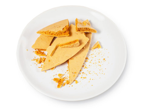 Caramel honeycomb on a white plate 01