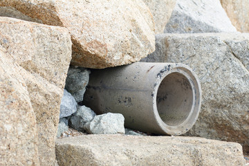 Trench mortar with stone on the beach background