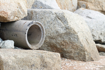 Trench mortar with stone on the beach background