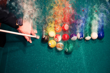 A group of balls in the video arrows breaks up into particles and debris
