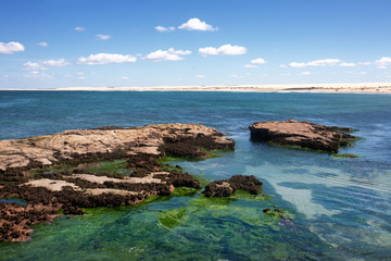 Rocks at Birubi Beach, part of the 34 kilometre stretch of Stockton Bight at Anna Bay, the longest coastal sand dunes in Australia.