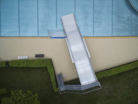 Directly above view of metal slide by pool, Sindelfingen, Baden-Wuerttemberg, Germany