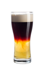 Glass of dark beer on white background