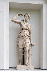 The Goddess Artemis. Statue of Pudozh stone in the niche of the Kitchen Corps of the Elagin Island Palace and Park Complex in St. Petersburg