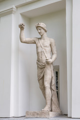 The God Apollo. Statue of Pudozh stone in the niche of the Kitchen Corps of the Elagin Island Palace and Park Complex in St. Petersburg