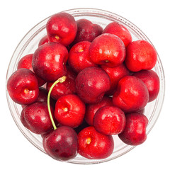 Cherry barries  in a glass bowl isolated on white background