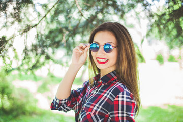 beautiful stylish women smile and relax in park. copy-space