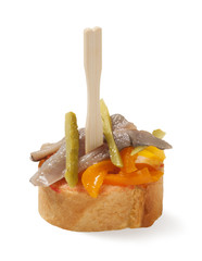 tapas with anchovies, bell pepper and pickles isolated on white