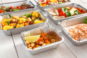 Healthy food take away, top view at wood background