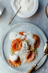 Carrot  pasta stuffed with cheese and vegetables, with béchamel sauce