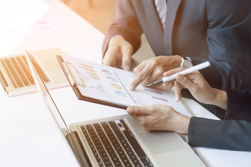 Business group discussing the solution of business affairs at the office