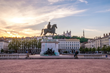 Monument of Louis XIV and Fourviere cathedral in Lyon, France