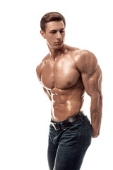 Muscular handsome young man with naked torso. Isolated on white background.