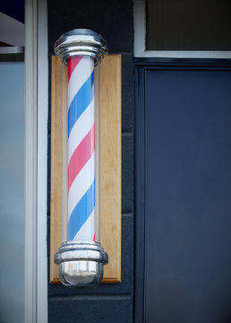 barbershop hairdresser traditional sign red blue and white spinning pole