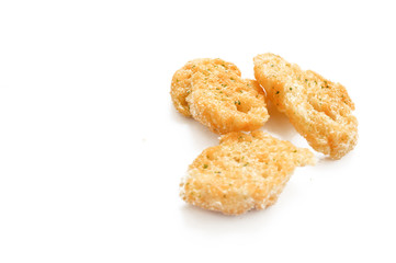 roasted bread bites isolated on white