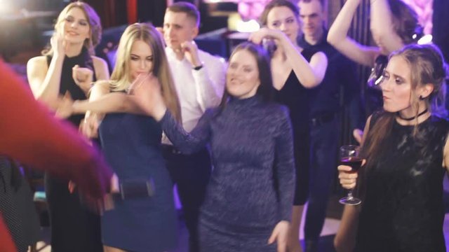 Friends dancing at a party, girls having a night out