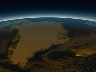 Greenland and Iceland from space in the evening