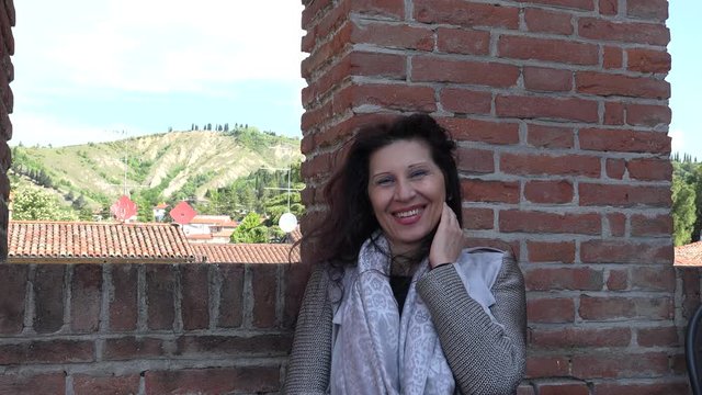 happy woman in castle in Italy