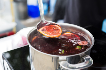 Making mulled wine for sale at country fair