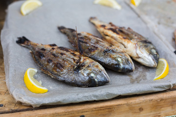 Seafood, dorado fish grilled at barbecue
