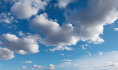 White clouds flying against blue sky.