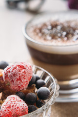 Sweet fruit dessert and cappuccino cup