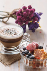 Sweet fruit dessert and cappuccino cup