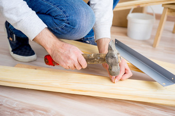 Man hammering nails