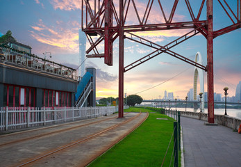 Empty road surface floor and pier of iron tower with city landmark architecture