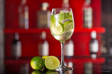 Glass of Hugo cocktail on a background