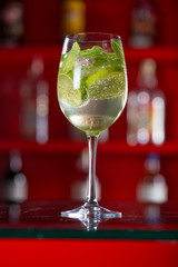 Glass of Hugo cocktail on a background
