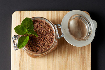 chocolate mousse with mint in a glass jar