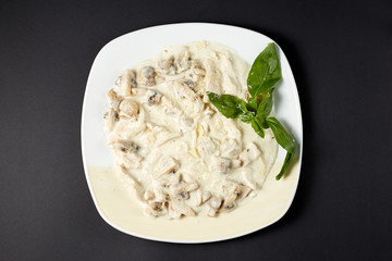 Chicken fillet with mushrooms in creamy sauce. Italian style. Italian food. Italian cuisine.
