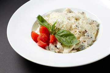 Fettuccine with chicken and mushrooms. Italian style. Italian food. Italian cuisine.