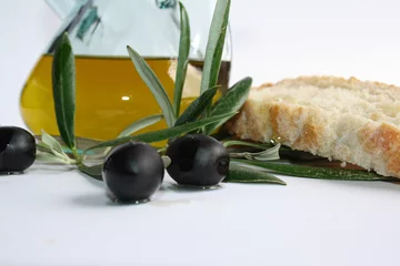 Foto op Plexiglas glass decanter with olive oil and bread © larisa