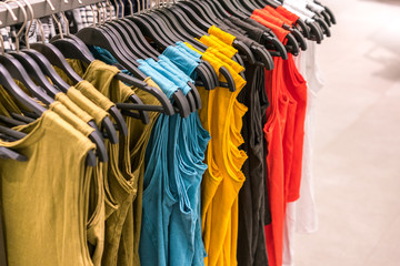 colorful women shirt in clothes rack 