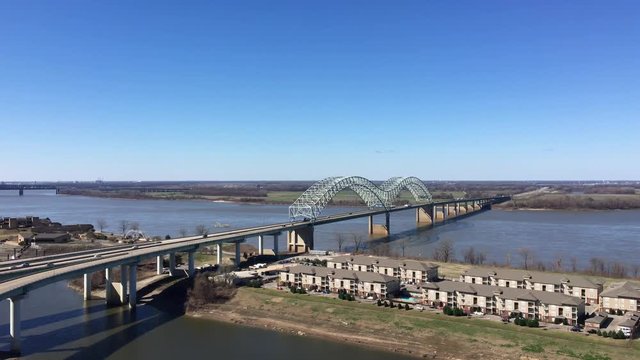 Pan of Mississippi River from Arkansas to Memphis, Tennessee, along Interstate 40.