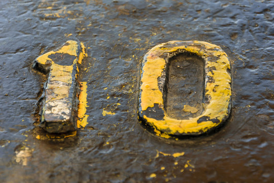 A number ten yellow on a bollard in the dock