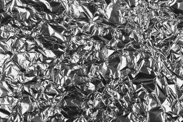 crumpled silver aluminum foil background, abstract texture