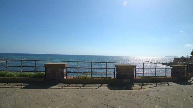 Alghero seafront under a clear sky, Italy