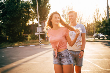 a couple roller-skating at sunset