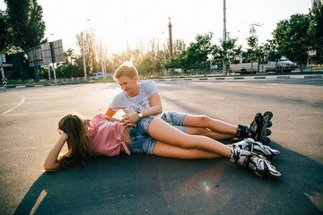 Loving couple lying on the asphalt