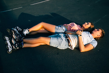 Loving couple lying on the asphalt. 