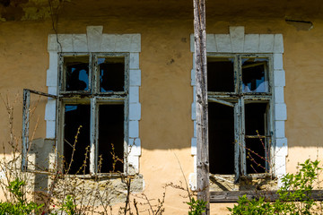 Roztots'ka Pastil', Ukraine - April 25, 2017: Windows of an abandoned old house made of adobe on the outskirts of the village in the south-western Ukraine.